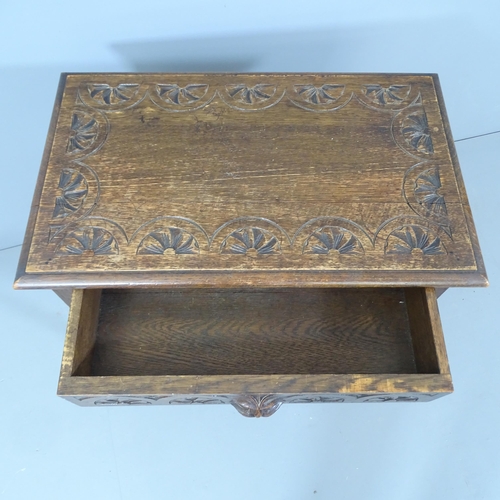 2178 - An antique carved oak side table, on turned legs with all around stretcher and carved green man deco... 