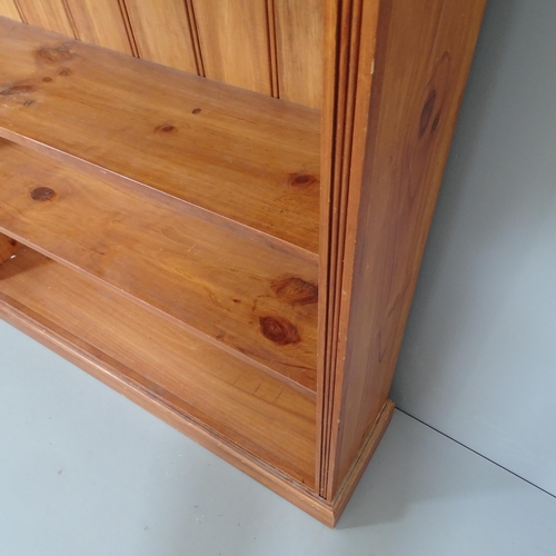 2180 - A large modern pine bookcase. 122x212x30cm