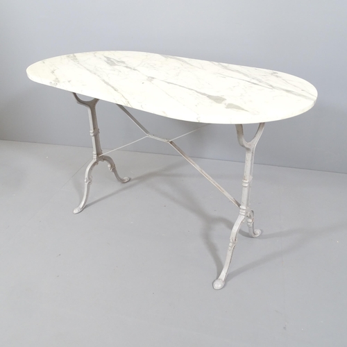 2182 - An oval marble-topped garden table on painted cast iron frame. 120x72x60cm.