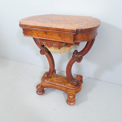 2183 - A Regency burr walnut sewing table. 63x74x46cm