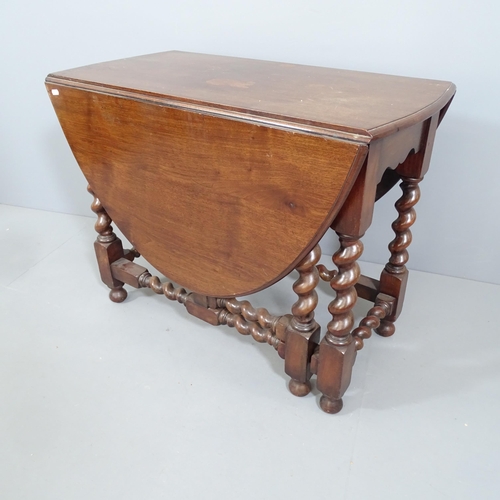 2185 - An antique oak barley-twist oval gateleg table. 91x70x44cm (extending to 136cm).