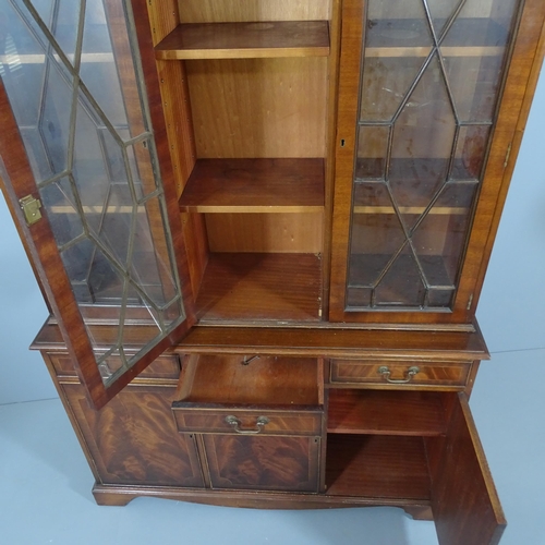 2188 - A Georgian style flame mahogany 2-section bookcase with 3 glazed doors, 3 drawers and 3 cupboard doo... 