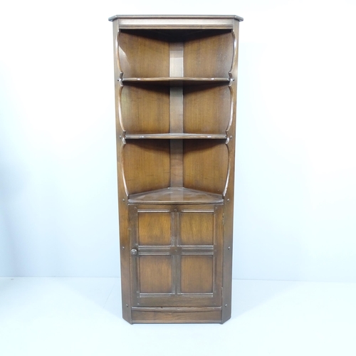 2196 - A mid-century elm Ercol corner cupboard, with maker's label. 71x184x50cm.