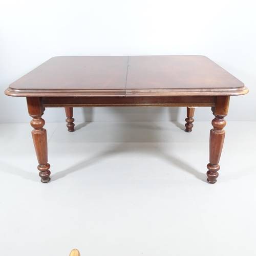 2198 - An antique mahogany drawer leaf dining table, with two spare leaves and raised on turned legs. 155 (... 