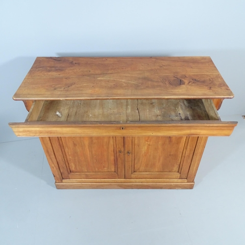 2200 - A French cherrywood sideboard, with single frieze drawer above two cupboard doors revealing a shelve... 