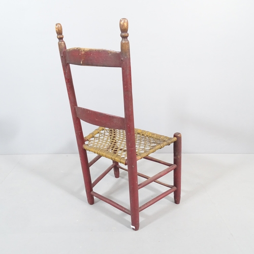 2204 - An early 19th century primitive chair with original paintwork and rawhide seat.