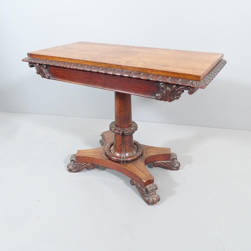 2205 - A 19th century rosewood fold-over card table, on turned central column with platform base. 93x74x46c... 