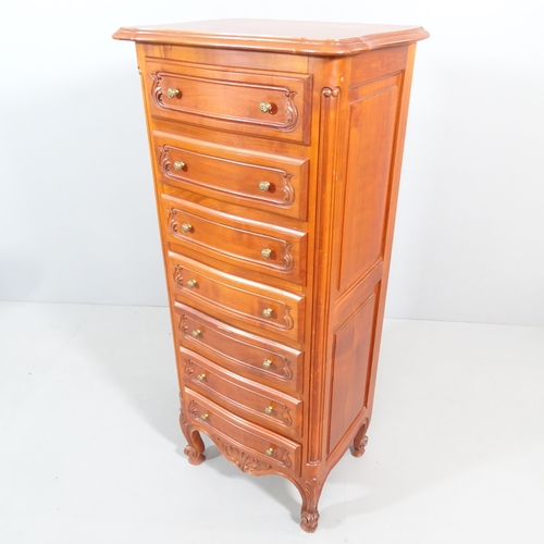 2208 - A French cherrywood narrow chest of seven drawers. 57x134x43cm.