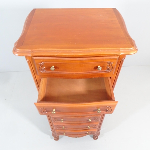 2208 - A French cherrywood narrow chest of seven drawers. 57x134x43cm.