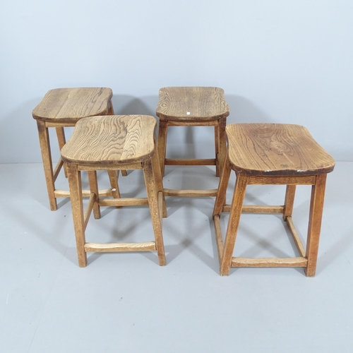 2211 - A matched set of four vintage elm-seated school lab stools. 36x52x34cm.