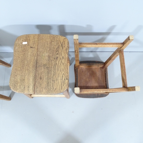 2212 - A matched set of three vintage elm-seated school lab stools. 36x52x34cm.