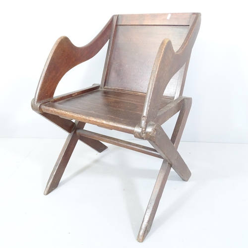 2215 - An antique oak Glastonbury chair.