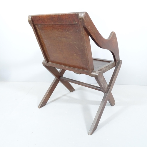 2215 - An antique oak Glastonbury chair.