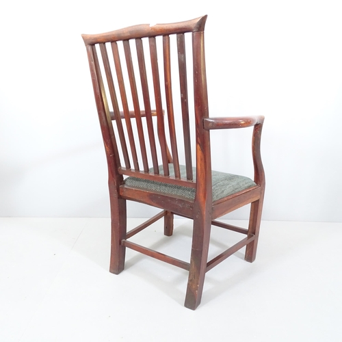 2216 - A Georgian oak armchair with upholstered seat.