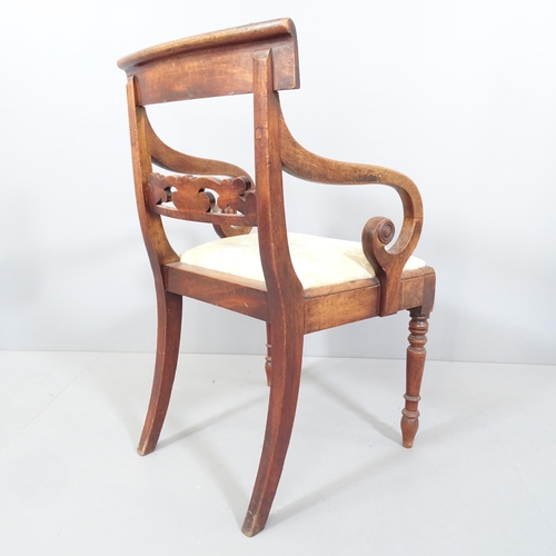 2217 - An antique Regency mahogany armchair with scrolled arms and upholstered seat.