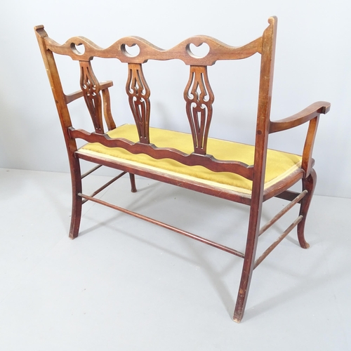 2218 - An Edwardian mahogany 2-seater settee with upholstered seat. 108x95x60cm.