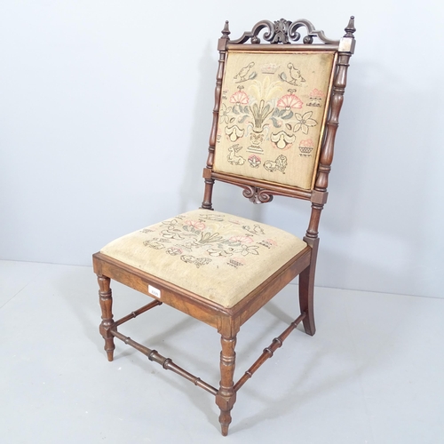 2220 - A 19th century rosewood nursing chair with needlepoint upholstered seat and back panel.