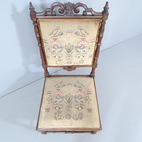 2220 - A 19th century rosewood nursing chair with needlepoint upholstered seat and back panel.