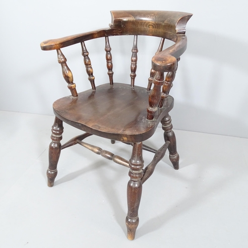 2225 - An antique elm-seated smoker's bow arm chair.