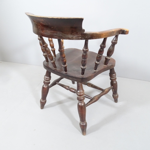 2225 - An antique elm-seated smoker's bow arm chair.