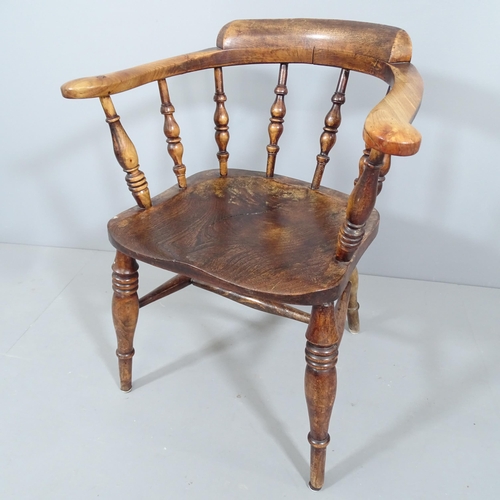 2226 - An antique elm-seated smoker's bow-arm chair.