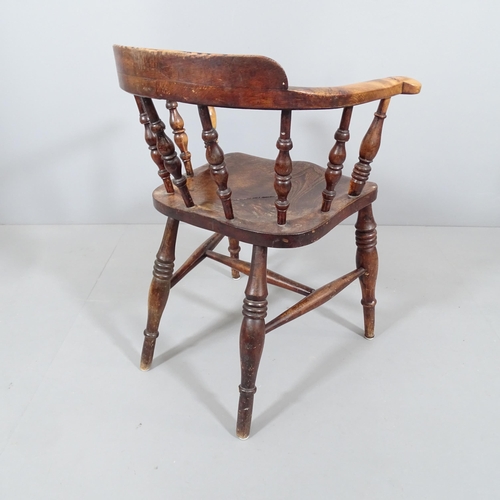 2226 - An antique elm-seated smoker's bow-arm chair.