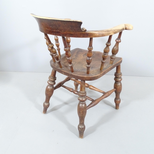 2227 - An antique elm-seated smoker's bow-arm chair.