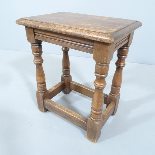 2229 - A Reprodux oak joint stool. 36x43x26cm.