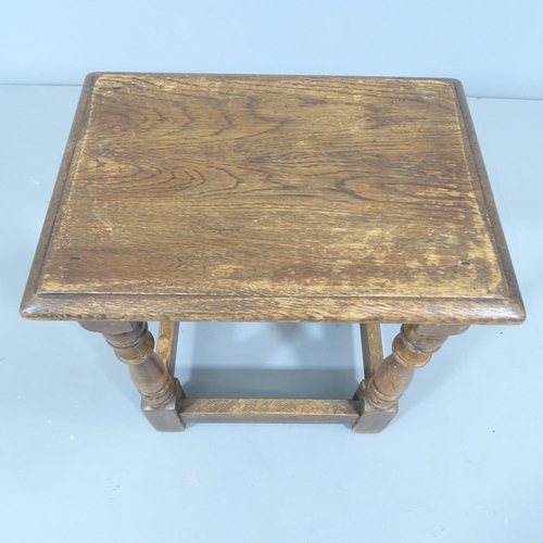 2229 - A Reprodux oak joint stool. 36x43x26cm.