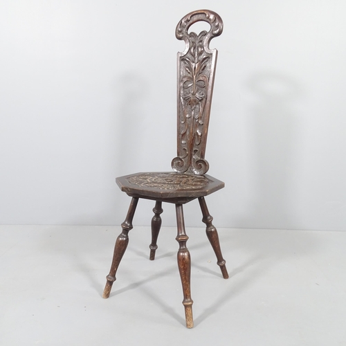 2274 - An antique oak spinning stool, with carved seat and removable back panel.