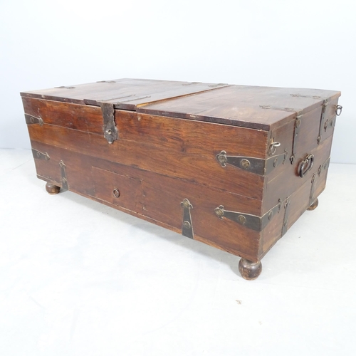 2505 - An oriental metal bound hardwood trunk, with three lifting lids revealing internal compartments and ... 