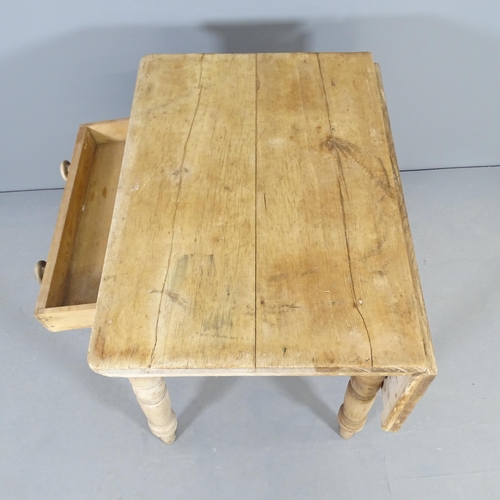 2508 - An antique pine table, with single drop leaf, frieze drawer and raised on turned legs. 82x72x58cm.