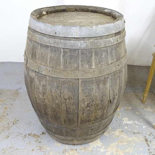 2511 - A vintage coopered-oak barrel. 78x95cm.