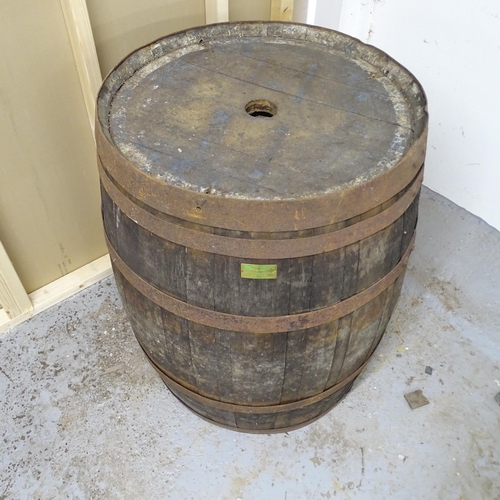 2512 - A vintage coopered-oak barrel. With label for Woodberry of Leamington Spa. 74x88cm.