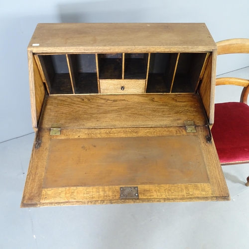 2516 - A modern oak bureau, with fall front, two drawers below and raised on turned legs, 78x98x45cm, and a... 