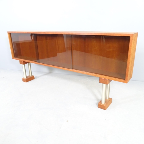 2518 - A mid-century teak low display cabinet with perspex sliding doors. 153x67x15cm.