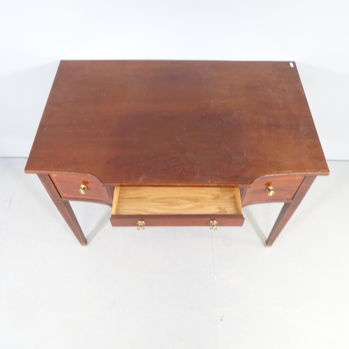 2527 - A 19th century style mahogany bow front writing desk, with three frieze drawers and raised on square... 