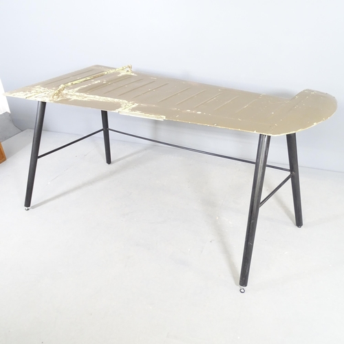 2528 - A vintage desk made from a painted aluminium aircraft aileron on metal base. 158x73x100cm.