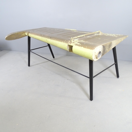 2528 - A vintage desk made from a painted aluminium aircraft aileron on metal base. 158x73x100cm.