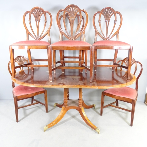 2539 - A set of six reproduction mahogany Prince of Wales style dining chairs, and a draw-leaf dining table... 