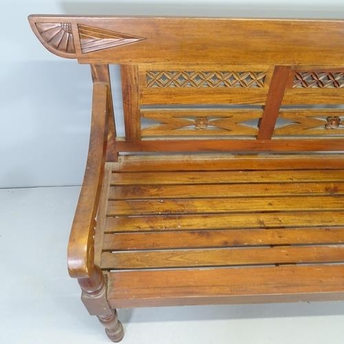 2553 - An Anglo-Indian colonial style teak bench. 140x93x60cm