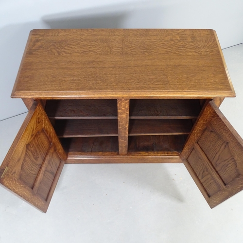 2554 - A reproduction oak two-door cabinet, with fielded panels and  shelf fitted interior. 92x77x41cm.