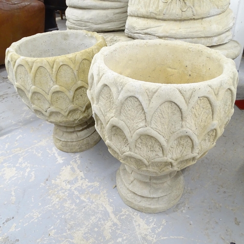 2563 - A pair of modern concrete two-section garden urns with pineapple decoration. 42x50cm.