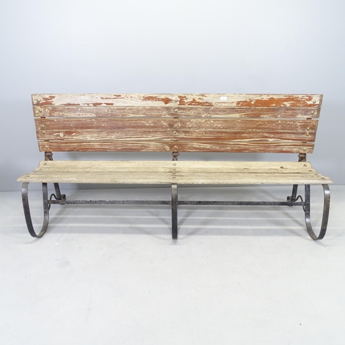 2658 - A folding teak slatted and iron framed garden bench. 180x82x52cm, folded H - 42cm.