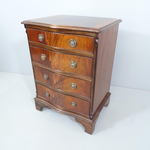 2237 - A reproduction crossbanded mahogany serpentine-front chest of four drawers on bracket feet. 54x74x43... 