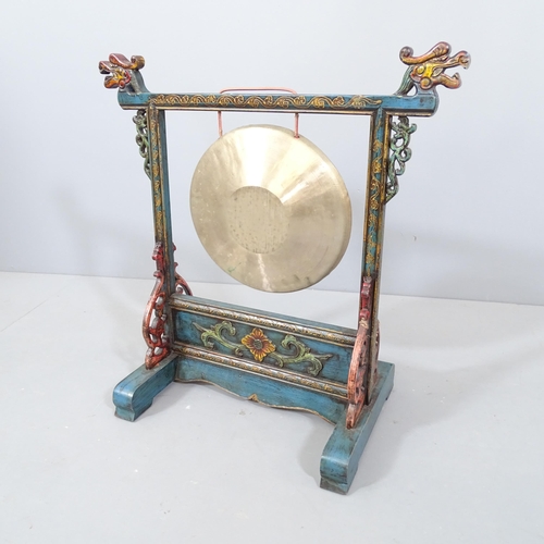 2240 - A Chinese gong on hand-painted stand with dragon mounts. 58x59x30cm.