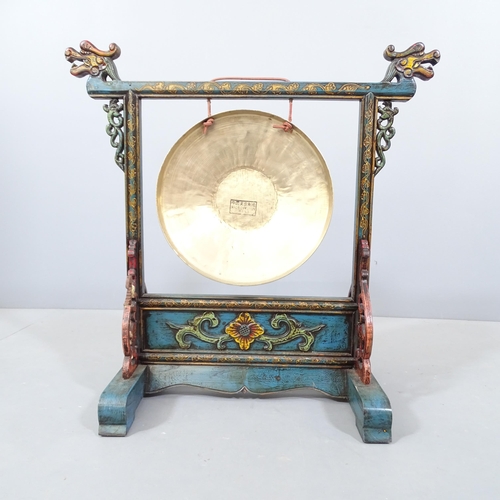 2240 - A Chinese gong on hand-painted stand with dragon mounts. 58x59x30cm.