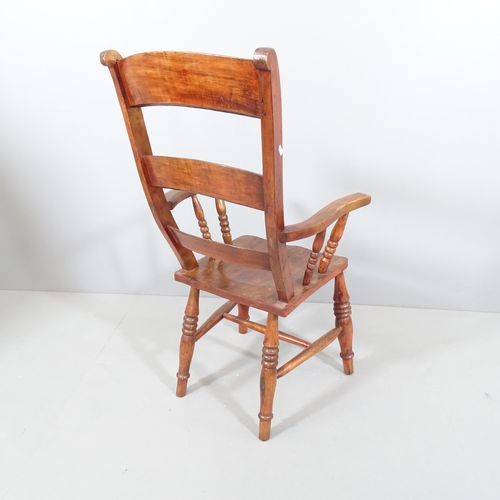 2249 - A stained pine Windsor kitchen armchair.