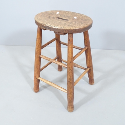 2251 - An antique oak stool. Height 54cm.