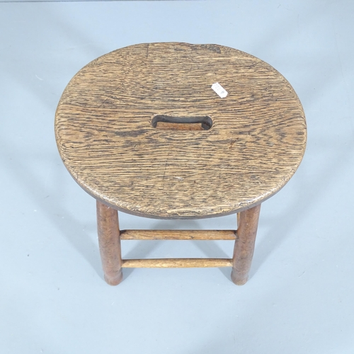 2251 - An antique oak stool. Height 54cm.